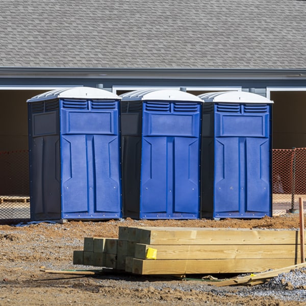 what is the cost difference between standard and deluxe portable toilet rentals in Long Island KS